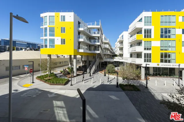 a view of building along with yard and seating space