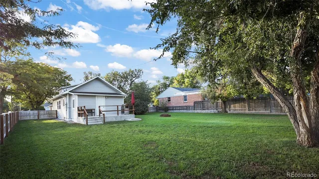 a view of a house with a yard porch and sitting area