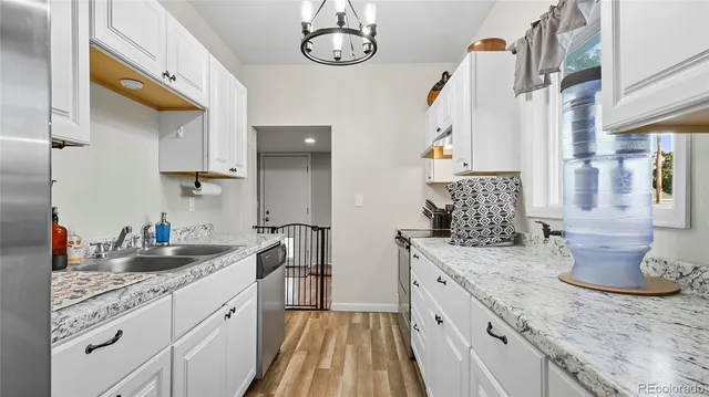 a spacious bathroom with a granite countertop double vanity sink and a mirror
