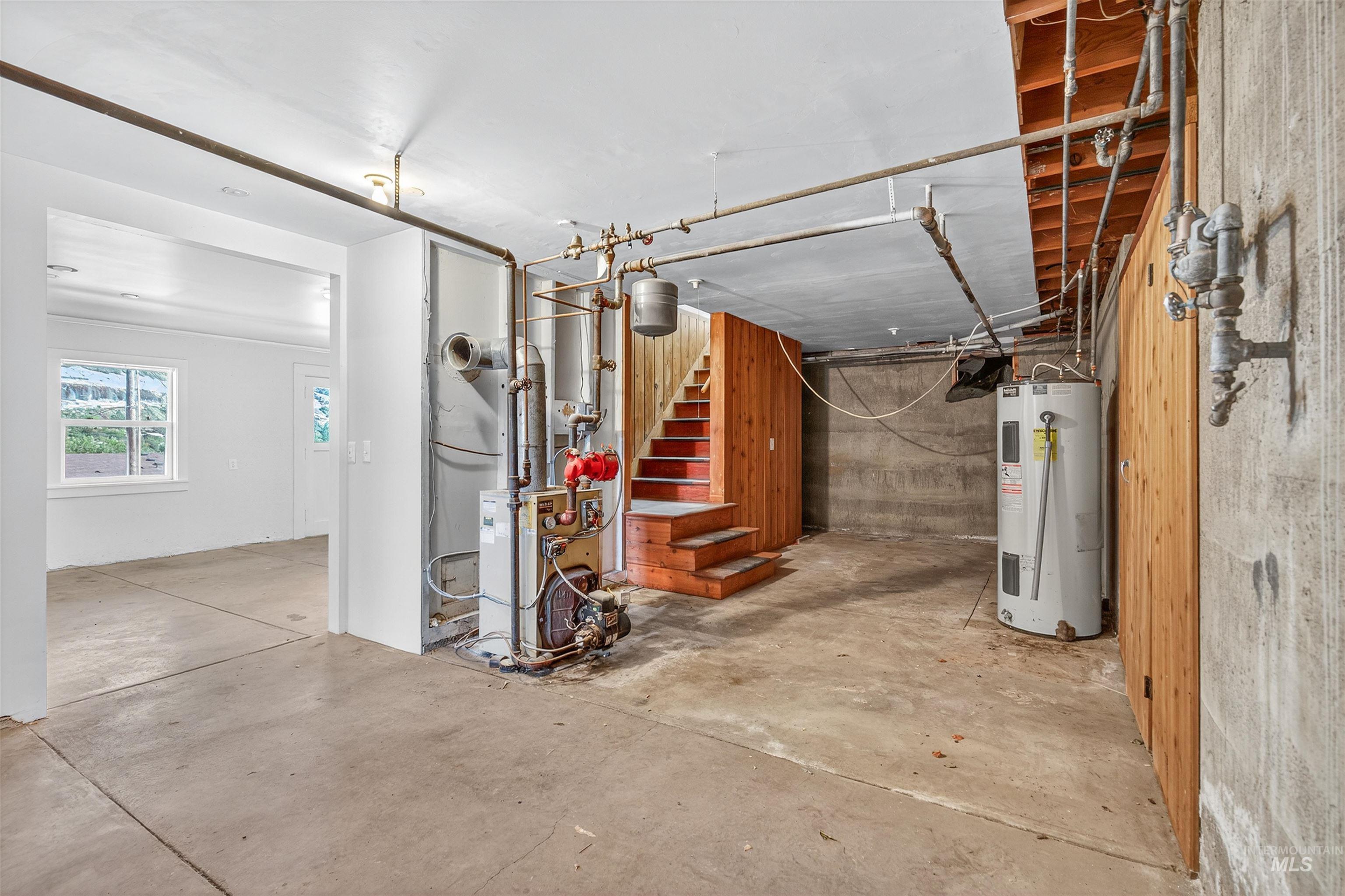 164 State Street Juliaetta, ID 83535 - Photo 26 of 37 Below grade area featuring water heater and a heating unit