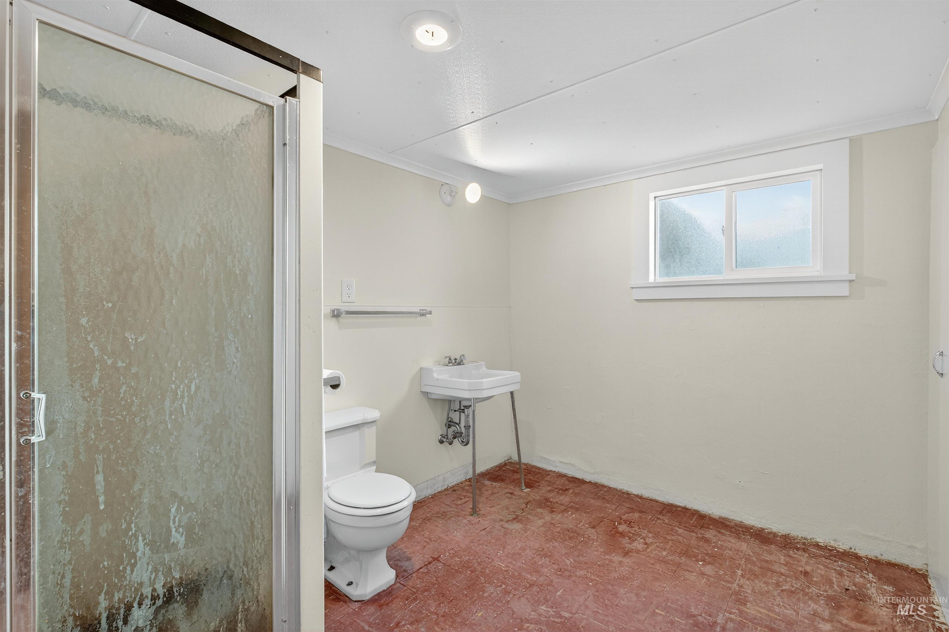 164 State Street Juliaetta, ID 83535 - Photo 27 of 37 Full bathroom with a stall shower and ornamental molding