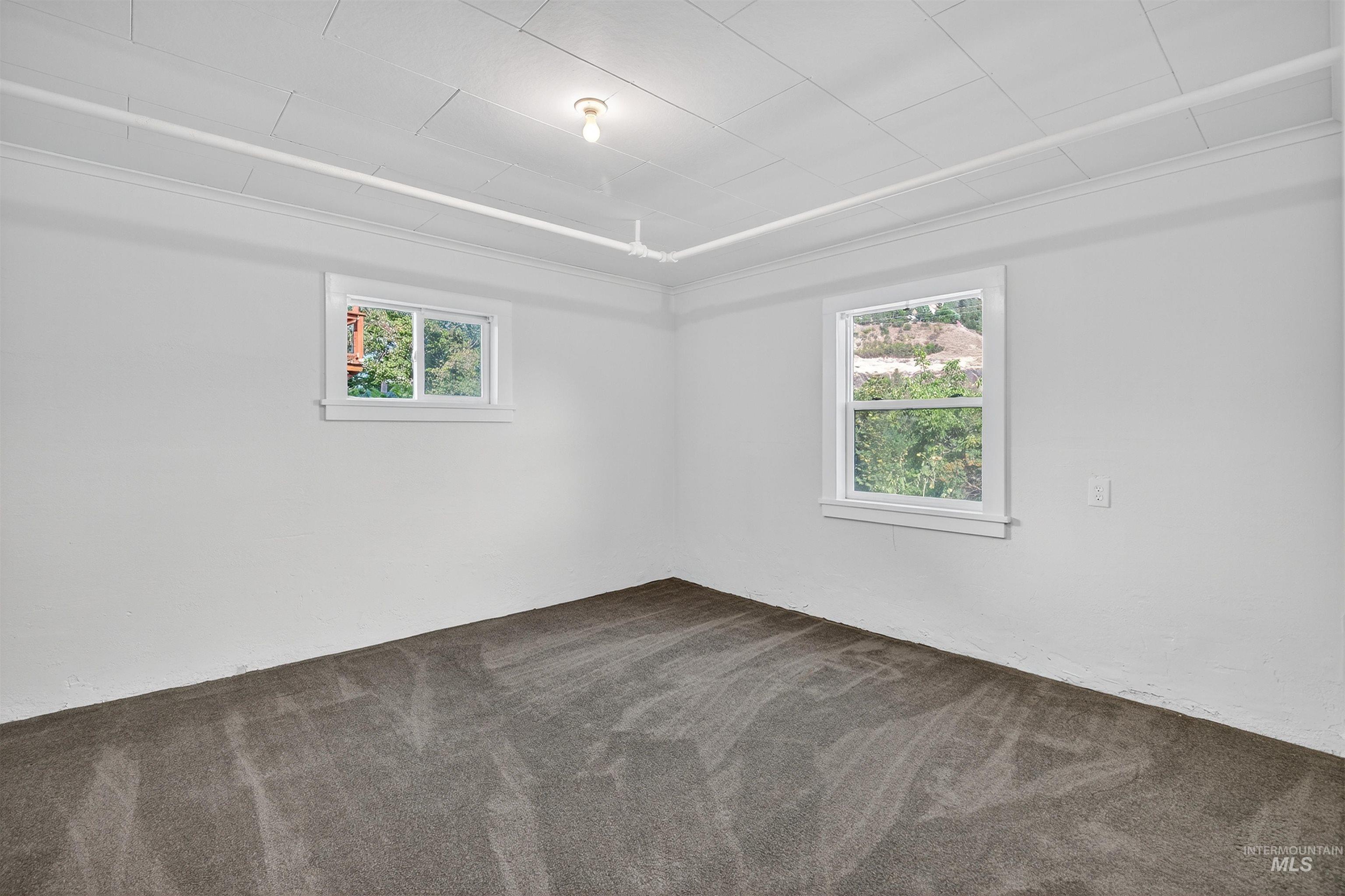 164 State Street Juliaetta, ID 83535 - Photo 29 of 37 Spare room with dark colored carpet