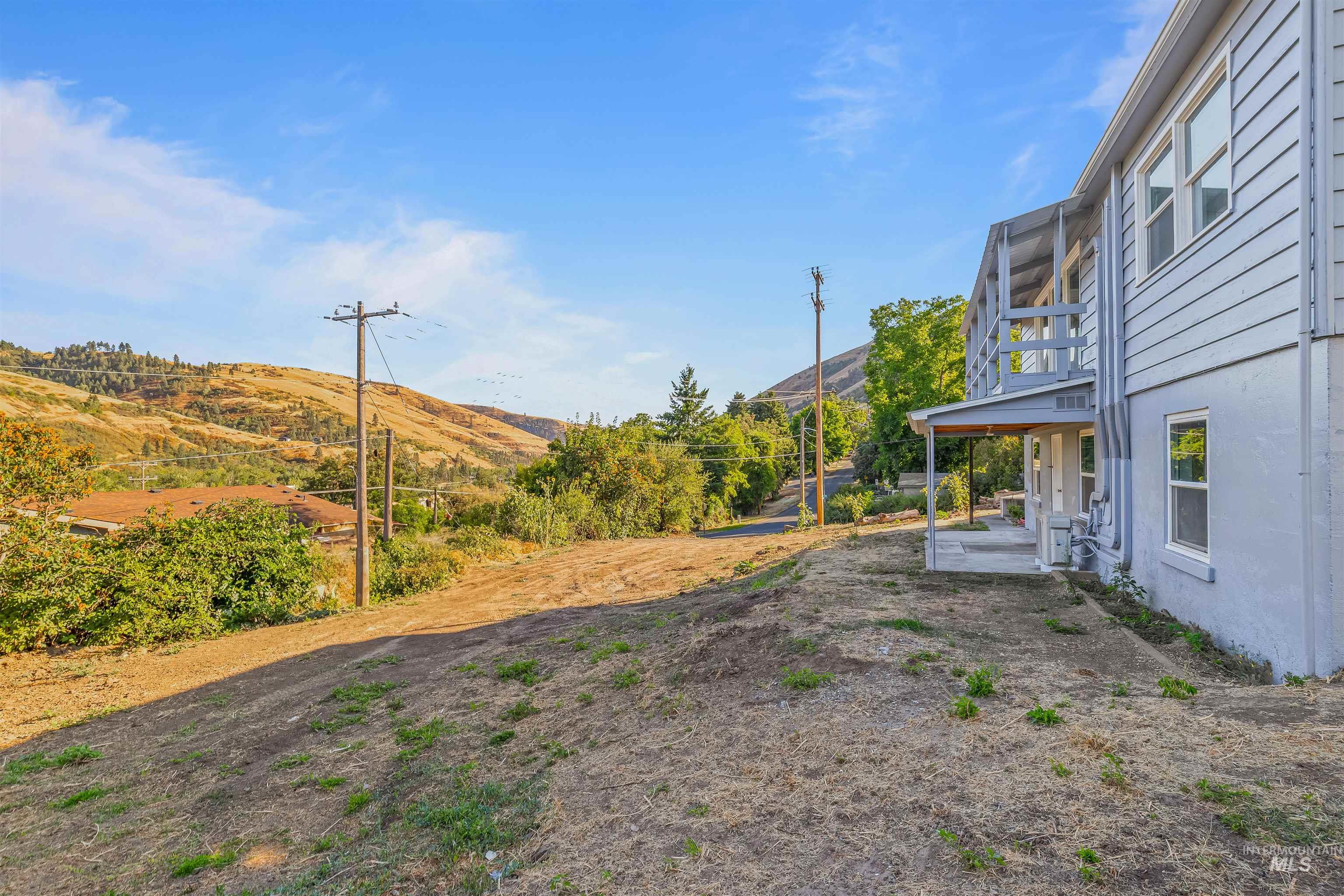 164 State Street Juliaetta, ID 83535 - Photo 33 of 37 View of yard with a mountain view and a patio