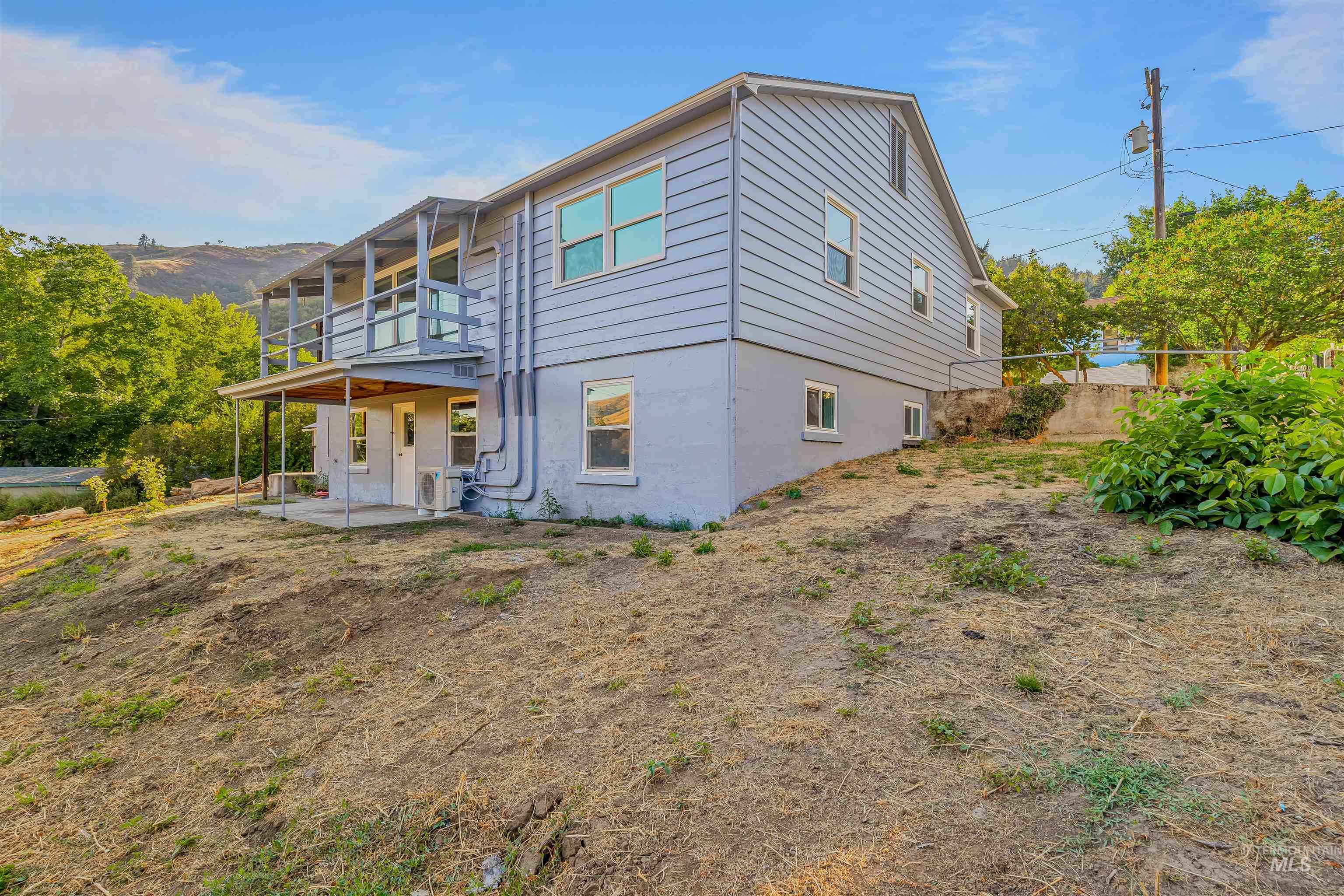 164 State Street Juliaetta, ID 83535 - Photo 34 of 37 Rear view of property with a patio and stucco siding