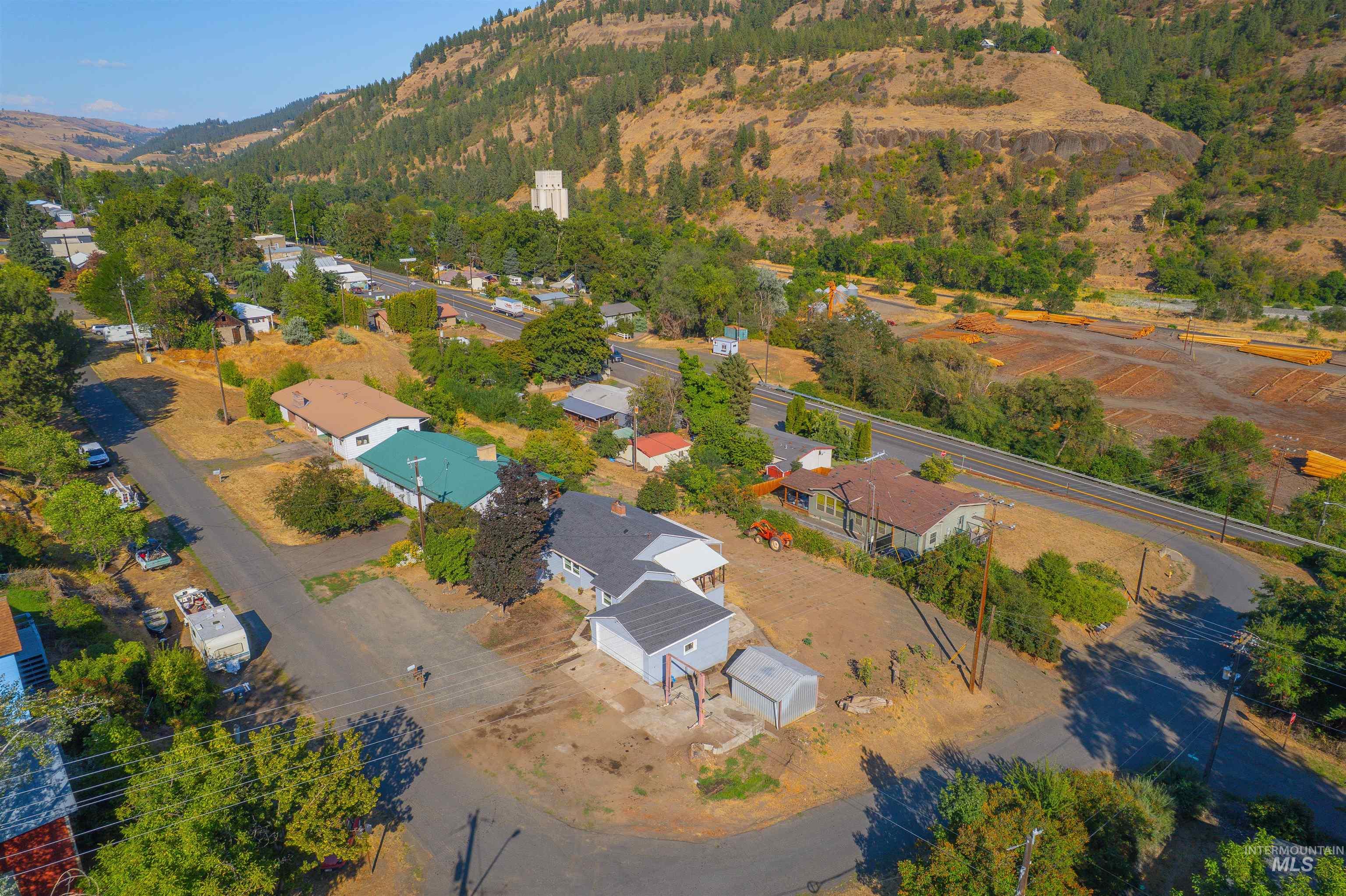 164 State Street Juliaetta, ID 83535 - Photo 6 of 37 Aerial overview of property's location with mountains and nearby suburban area