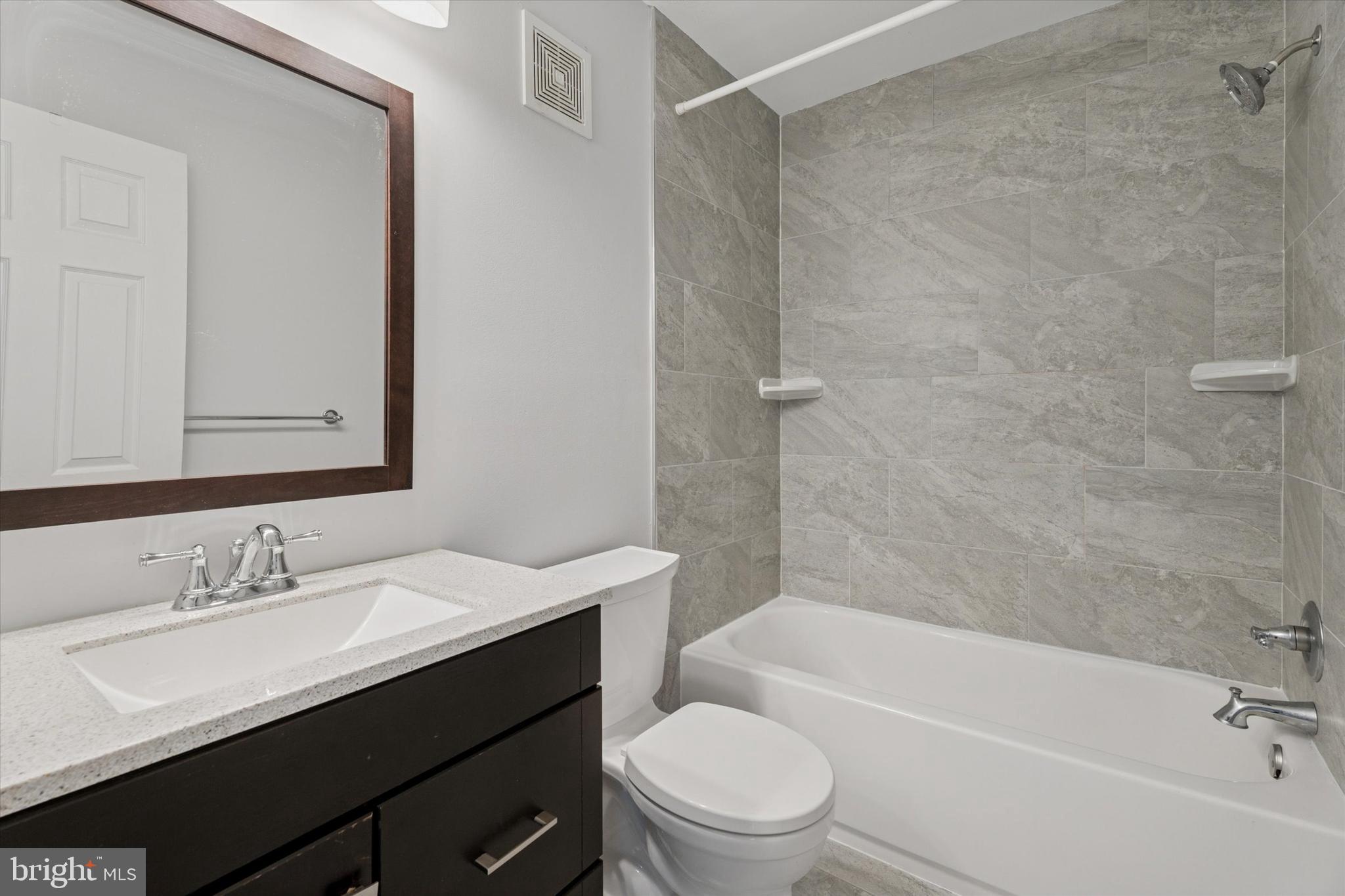 82 Bunker Hill Court, Unit 82 Wayne, PA 19087 - Photo 11 of 23 a bathroom with a sink a toilet and shower