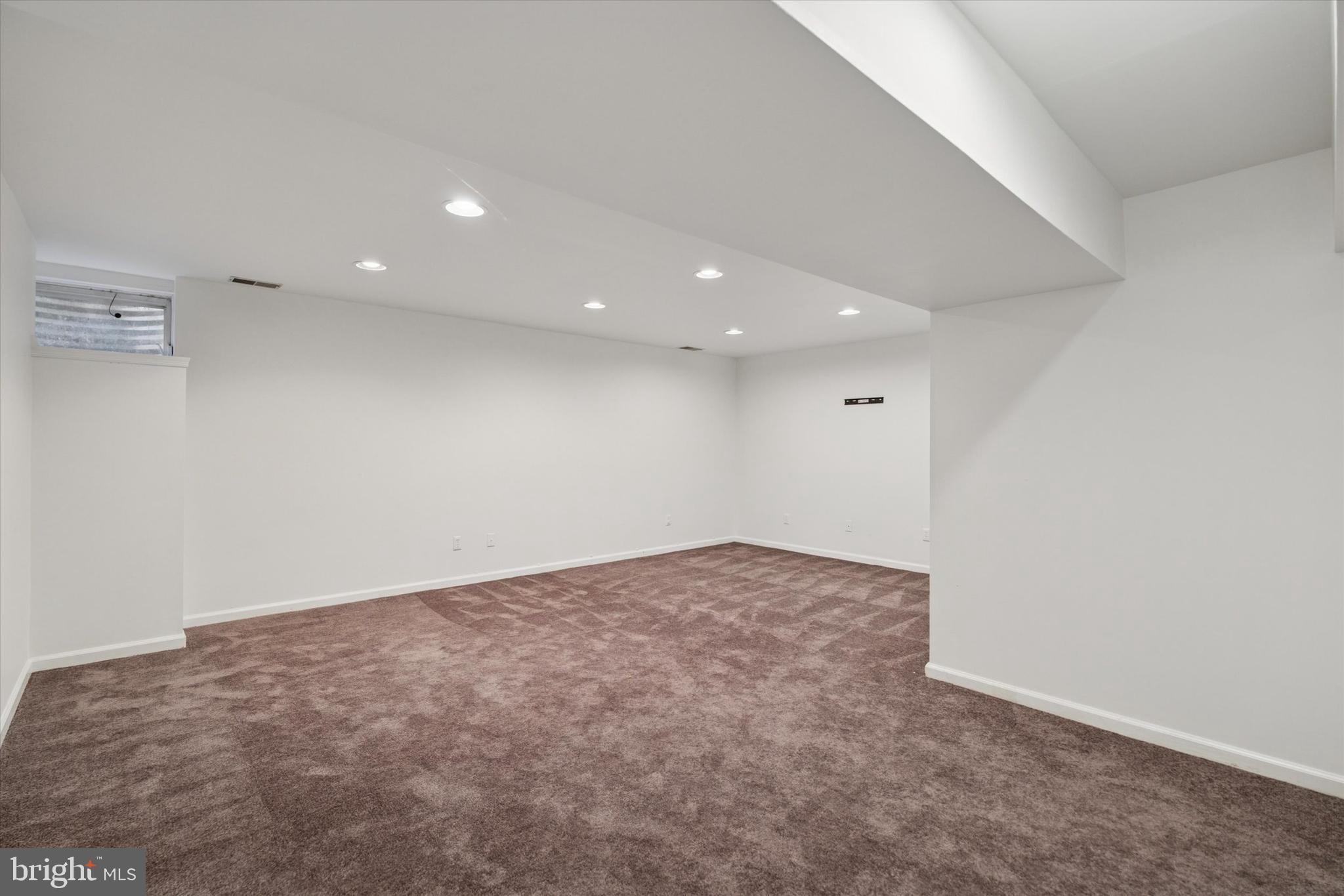 82 Bunker Hill Court, Unit 82 Wayne, PA 19087 - Photo 21 of 23 an empty room with a natural light