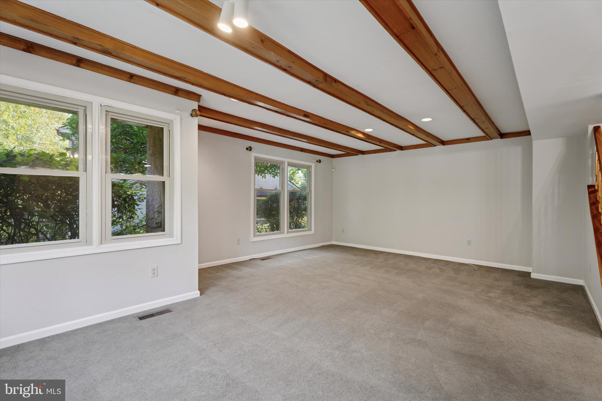 82 Bunker Hill Court, Unit 82 Wayne, PA 19087 - Photo 3 of 23 an empty room with windows