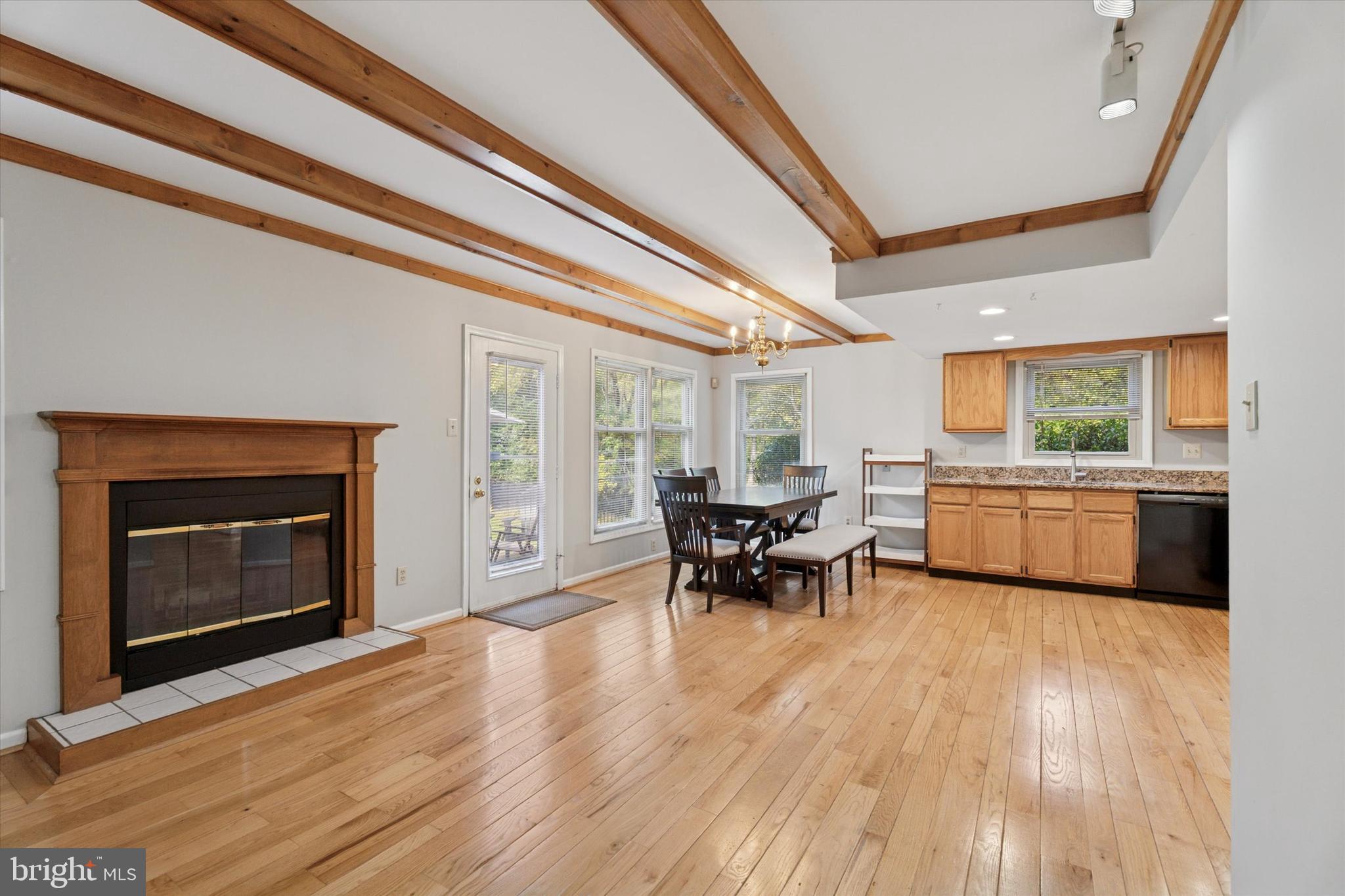 82 Bunker Hill Court, Unit 82 Wayne, PA 19087 - Photo 6 of 23 a view of a dining room with furniture and a fireplace