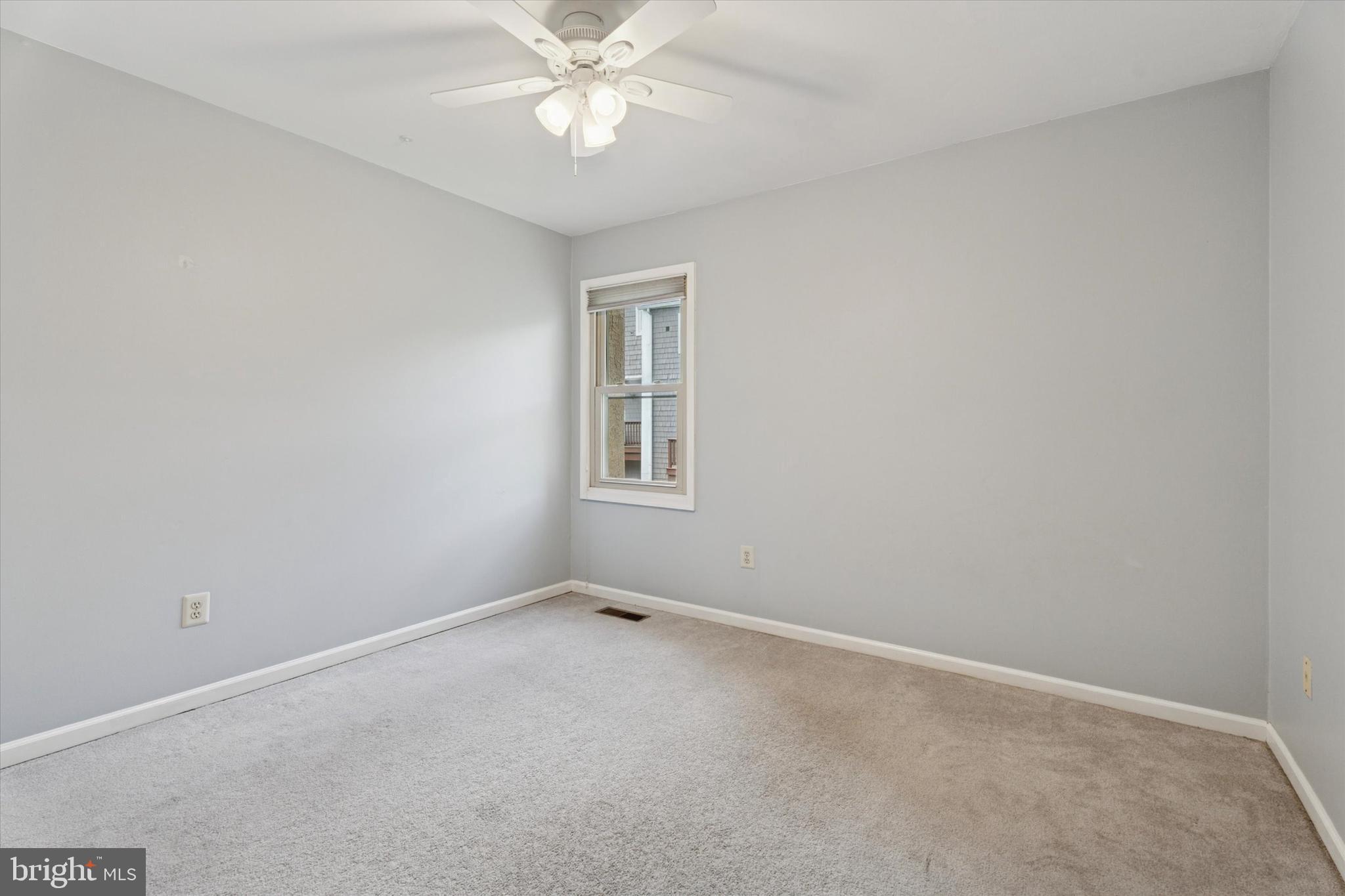 82 Bunker Hill Court, Unit 82 Wayne, PA 19087 - Photo 9 of 23 a view of an empty room with a fan