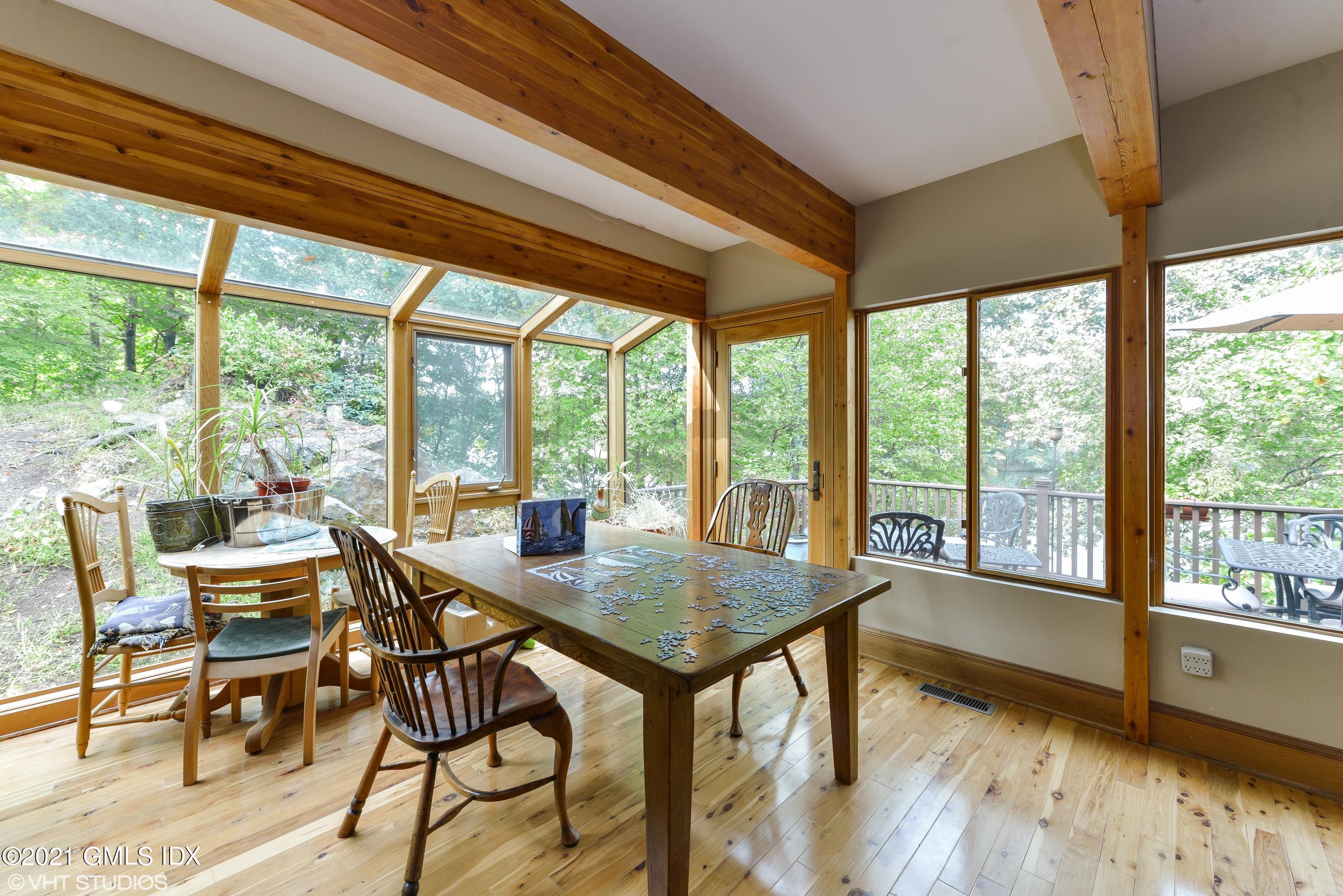 78 Long Meadow Road Riverside, CT 06878 - Photo 12 of 18 a view of a dining room with furniture and wooden floor