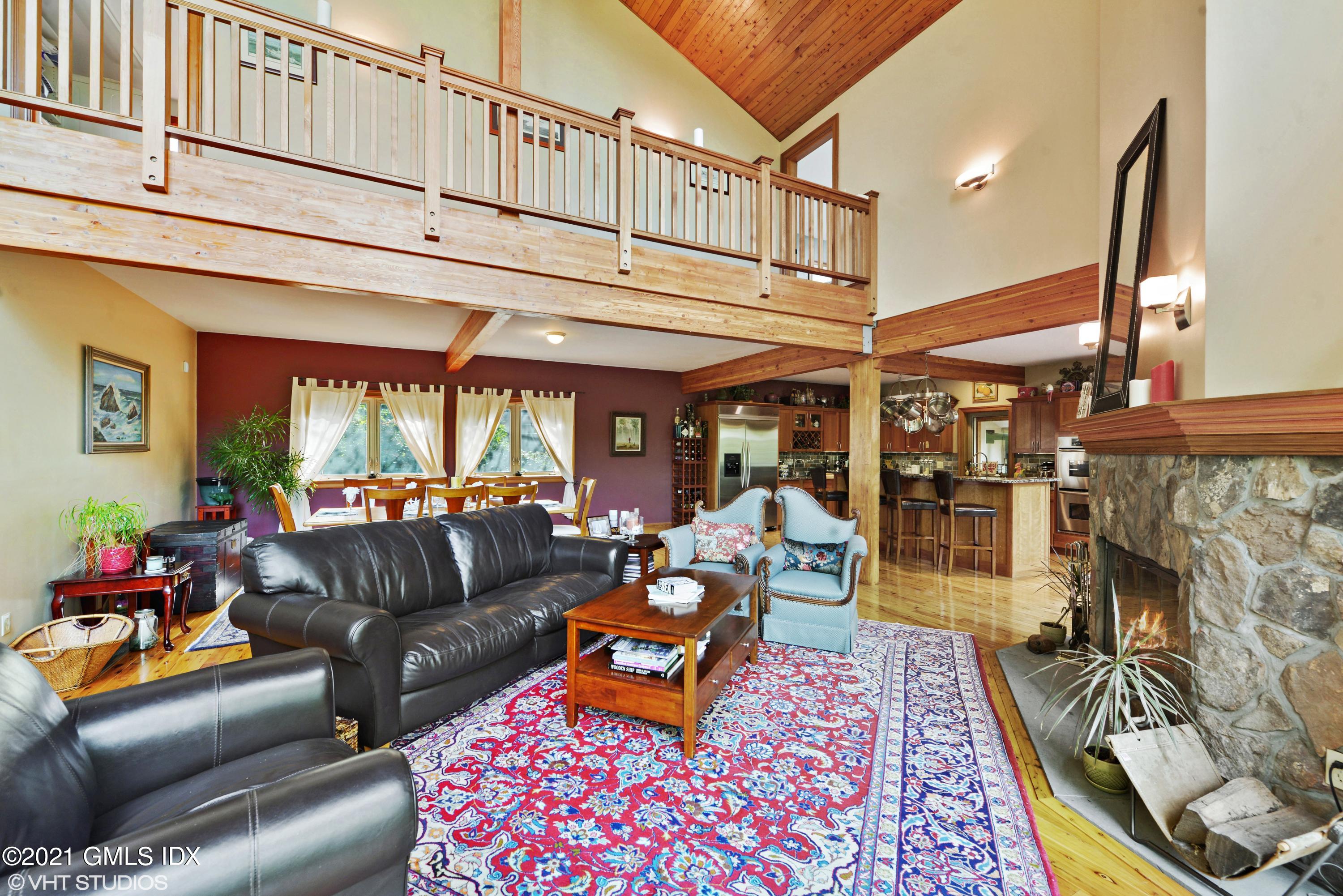 78 Long Meadow Road Riverside, CT 06878 - Photo 2 of 18 a living room with furniture a fireplace and a chandelier