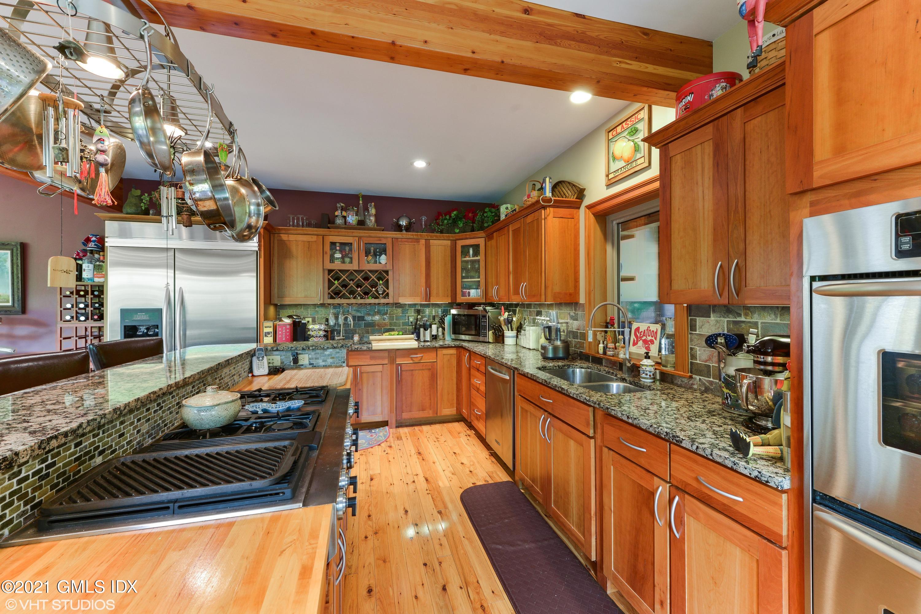 78 Long Meadow Road Riverside, CT 06878 - Photo 5 of 18 a kitchen with lots of counter top space and wooden floor