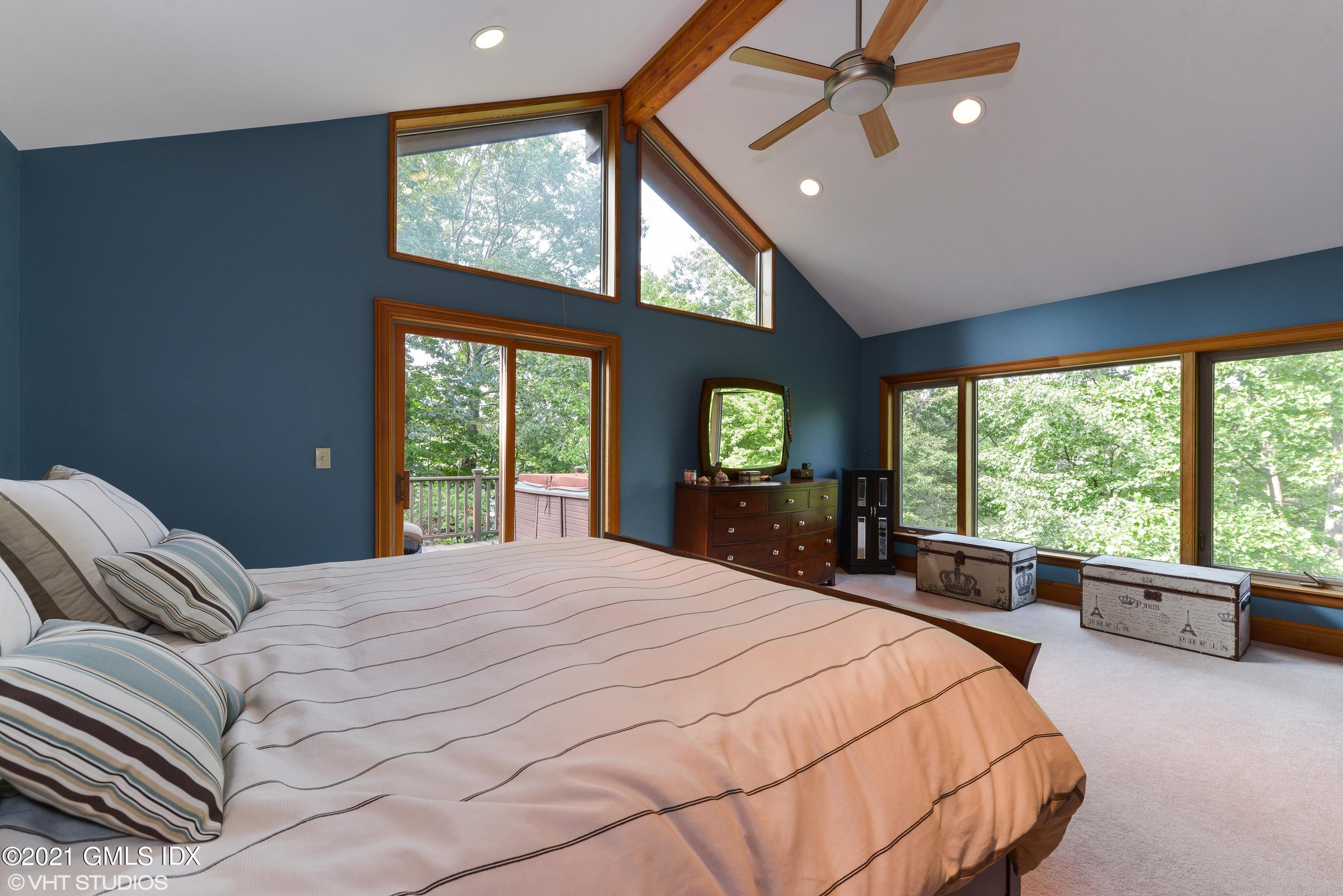 78 Long Meadow Road Riverside, CT 06878 - Photo 8 of 18 a bedroom with a large bed and a large window