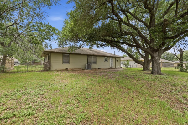 1608 Burt Street Bryan, TX 77802 - Photo 16 of 16 a white house that has a tree in front of it