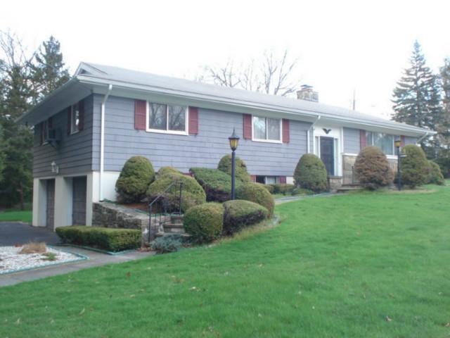 280 Oak Ridge Road Stratford, CT 06614 - Photo 1 of 1 a view of a house with a backyard