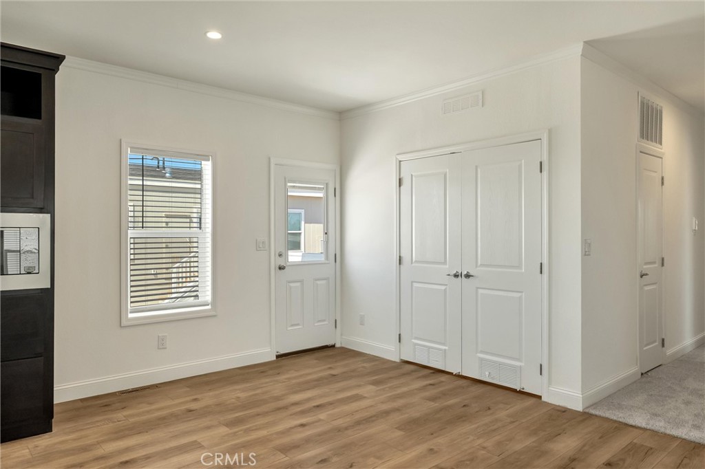 4333 Pentz Road, Unit 30 Paradise, CA 95969 - Photo 10 of 29 a view of an empty room with wooden floor and a window