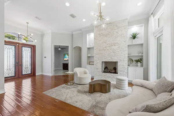a view of a livingroom with furniture window and wooden floor