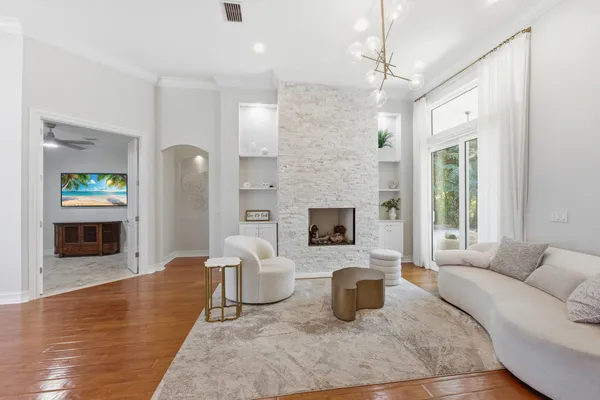 a living room with furniture and a large window