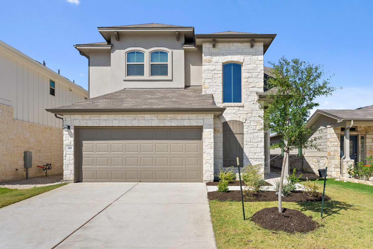 134 White Horses Drive Kyle, TX 78640 - Photo 1 of 1 a front view of a house with garden