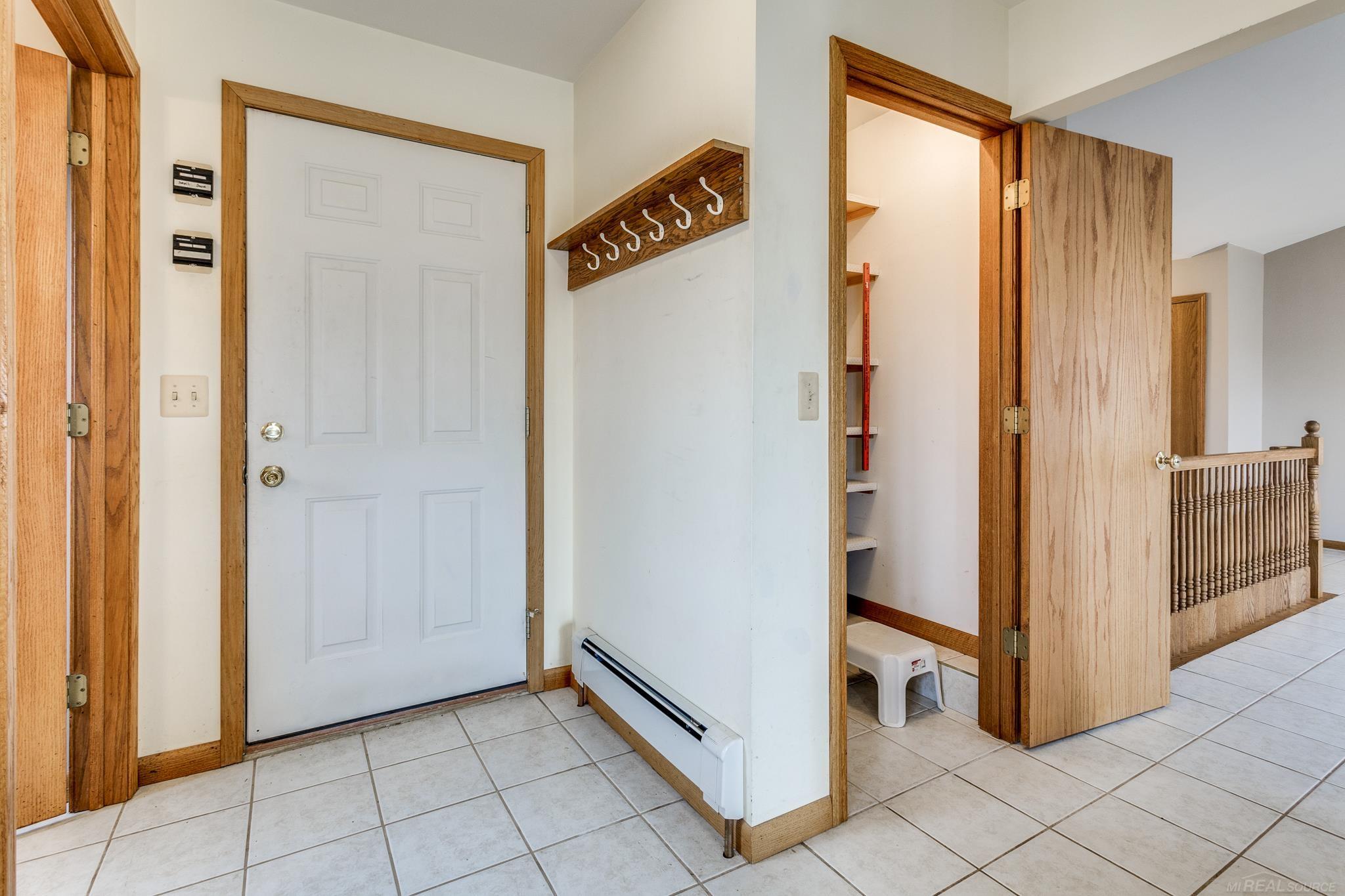 2829 Harneck Road Applegate, MI 48401 - Photo 51 of 77 Kitchen Pantry & Door Leading to Attached Garage