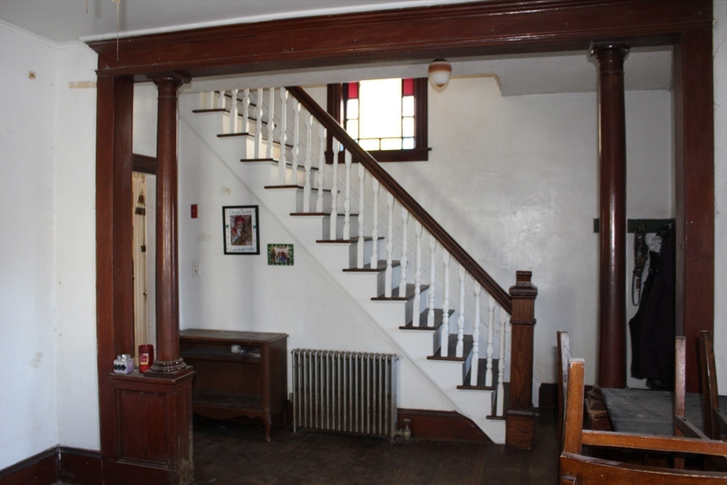 19 Smith Avenue Ware, MA 01082 - Photo 12 of 25 a view of entryway with wooden floor and stairs