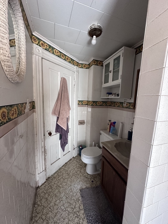 19 Smith Avenue Ware, MA 01082 - Photo 20 of 25 a bathroom with a white toilet and a shower curtain
