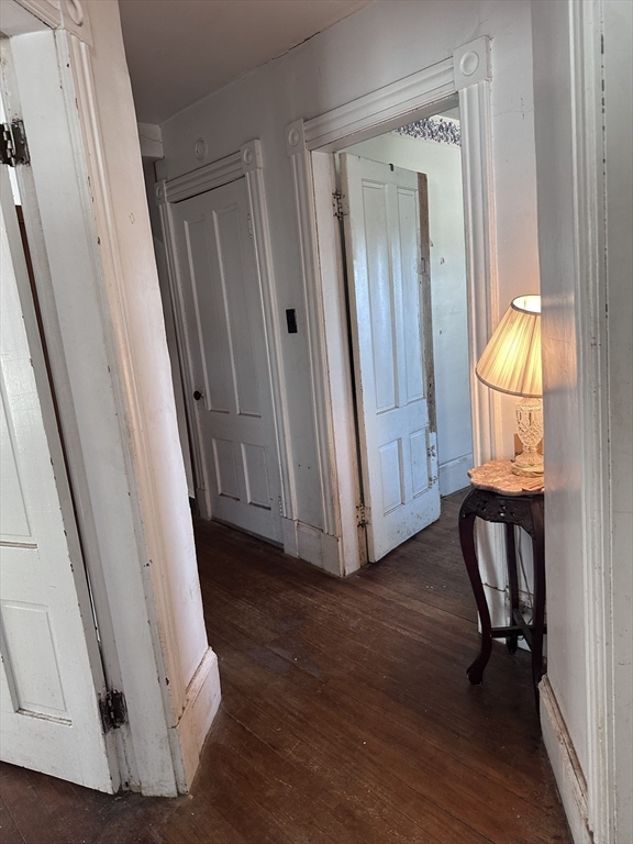 19 Smith Avenue Ware, MA 01082 - Photo 21 of 25 a view of front door with chair and wooden floor