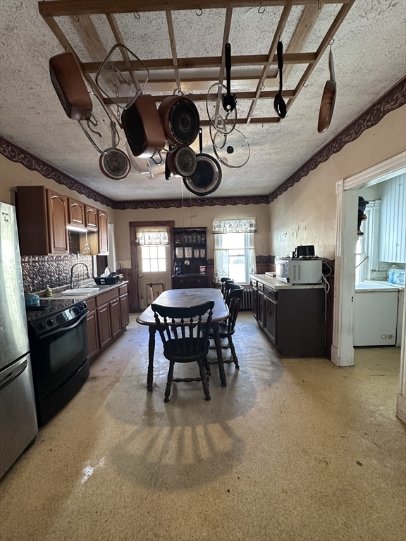 19 Smith Avenue Ware, MA 01082 - Photo 7 of 25 a kitchen with a table and chairs in it