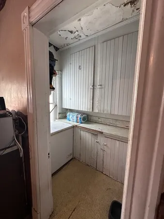 a living room with furniture and a tv