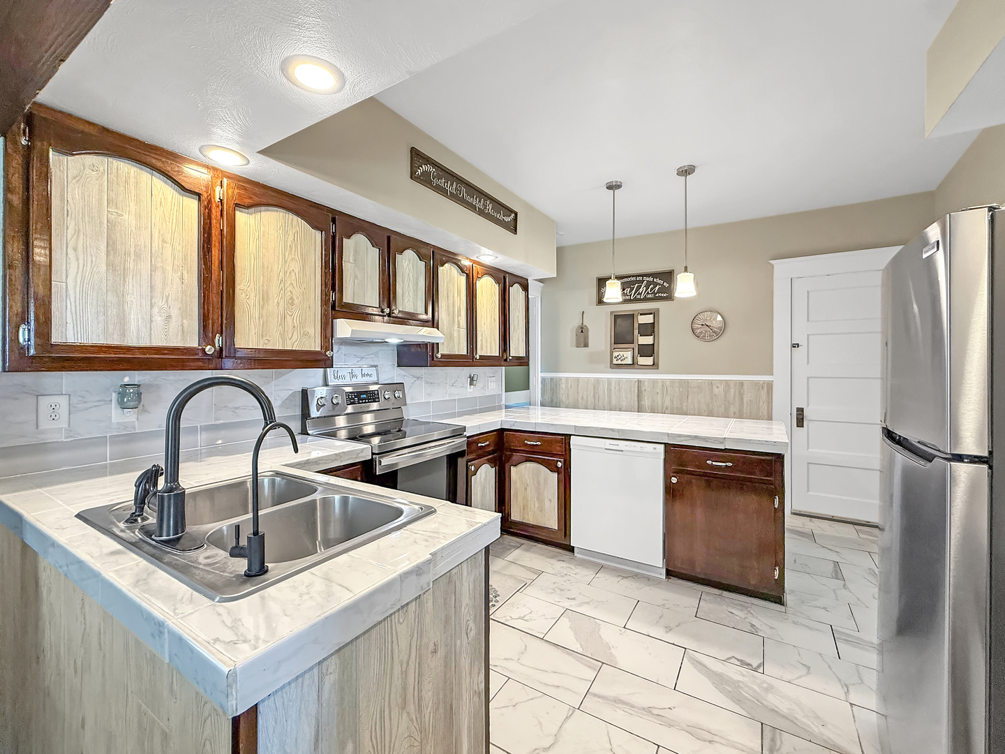 4895 West Stephenson St Road Freeport, IL 61032 - Photo 23 of 66 a kitchen with granite countertop a sink appliances and cabinets