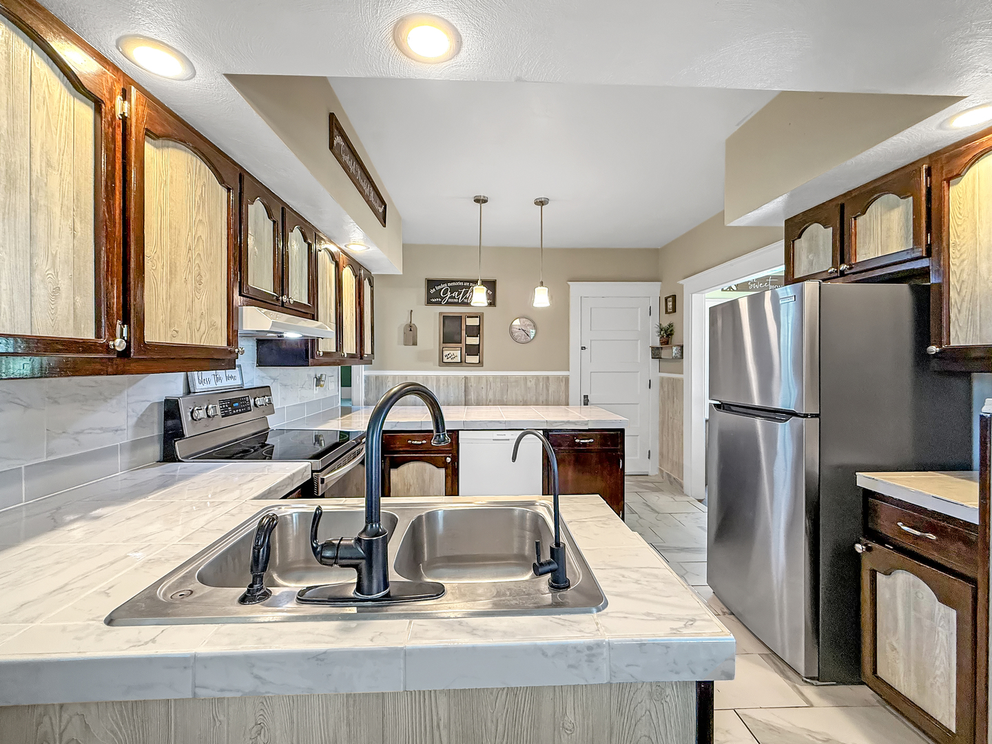 4895 West Stephenson St Road Freeport, IL 61032 - Photo 24 of 66 a kitchen with a refrigerator a sink and a stove