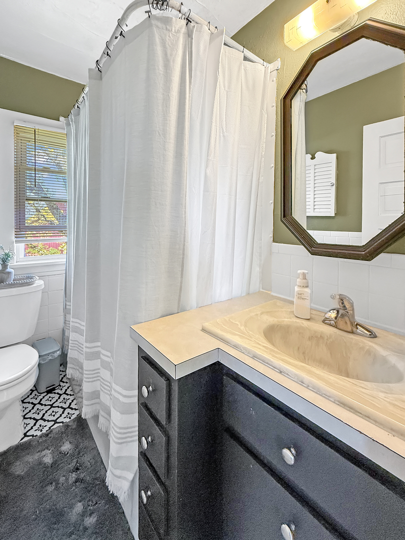 4895 West Stephenson St Road Freeport, IL 61032 - Photo 38 of 66 a bathroom with a sink and a mirror
