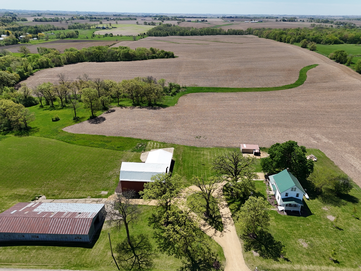 4895 West Stephenson St Road Freeport, IL 61032 - Photo 62 of 66 an aerial view of a house with a garden and lake view