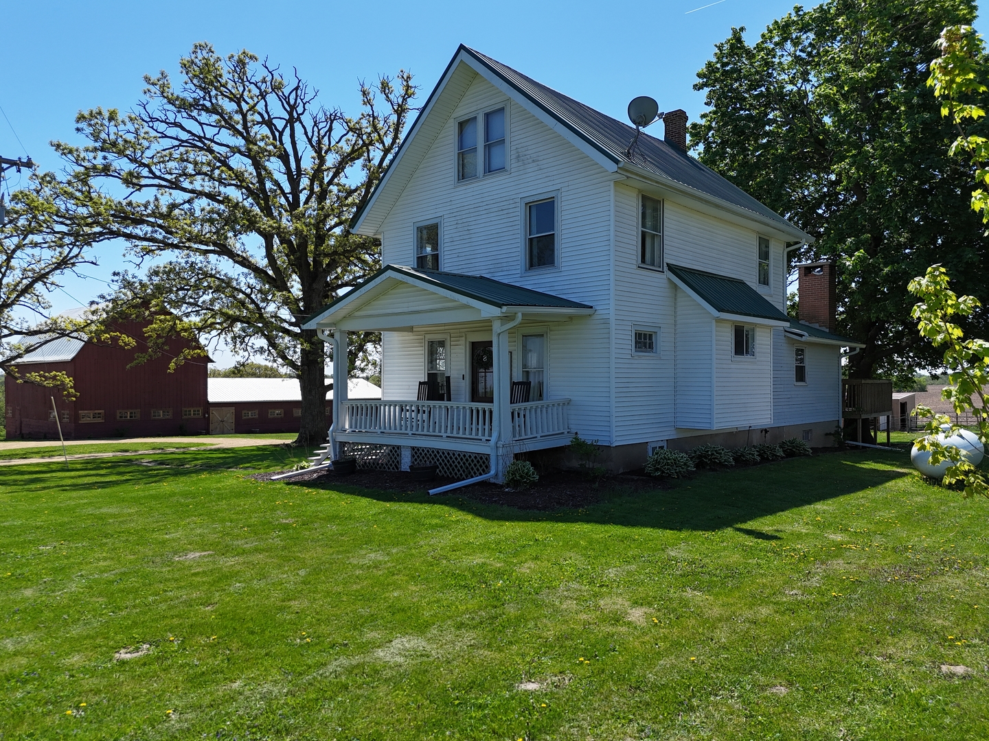 4895 West Stephenson St Road Freeport, IL 61032 - Photo 8 of 66 a front view of a house with a garden