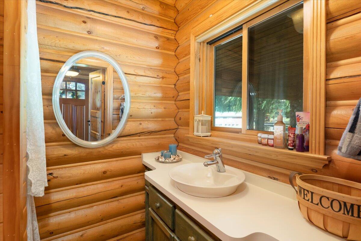 4208 Balls Ferry Road Cottonwood, CA 96022 - Photo 33 of 73 a bathroom with a sink and a mirror
