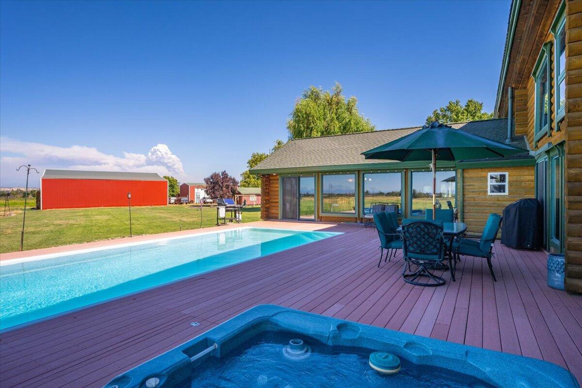 4208 Balls Ferry Road Cottonwood, CA 96022 - Photo 43 of 73 a view of a table and chairs in patio with a yard