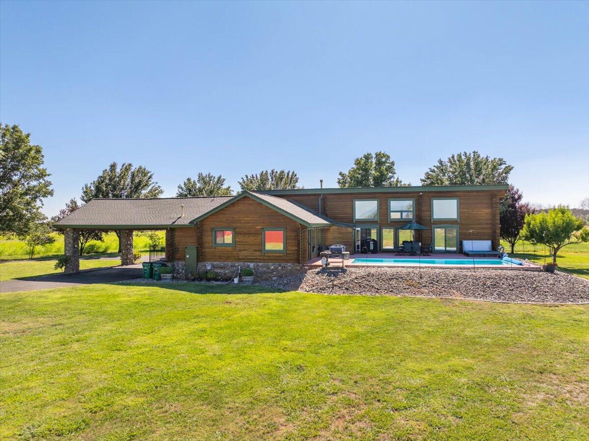 4208 Balls Ferry Road Cottonwood, CA 96022 - Photo 48 of 73 a view of a house with a yard