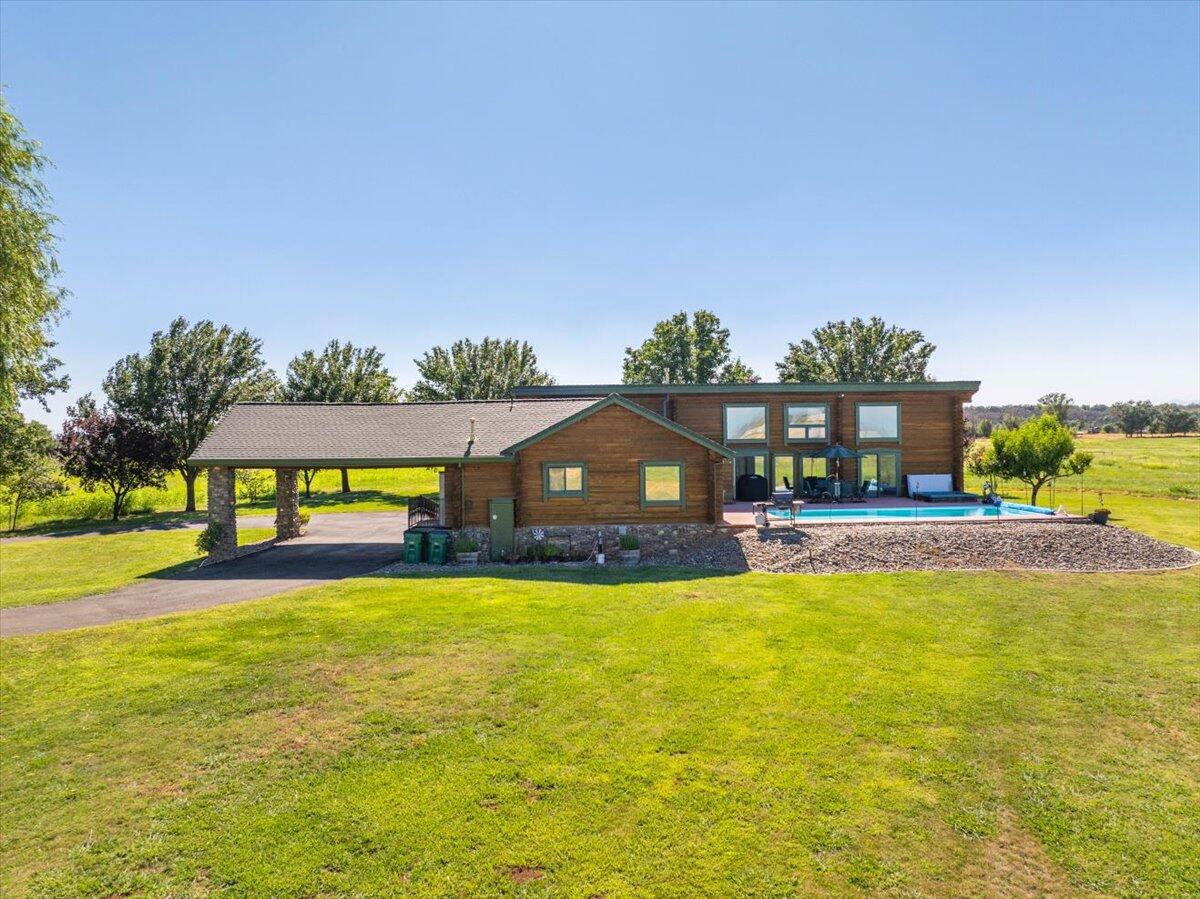 4208 Balls Ferry Road Cottonwood, CA 96022 - Photo 49 of 73 a view of a swimming pool with an outdoor space and seating area