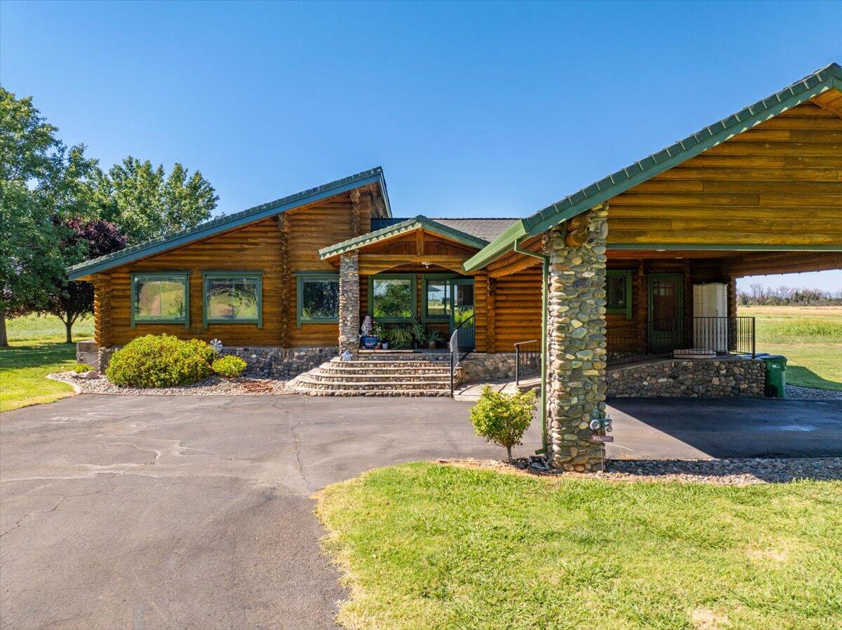 4208 Balls Ferry Road Cottonwood, CA 96022 - Photo 7 of 73 a front view of a house with garden