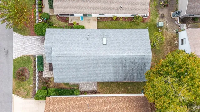 an aerial view of a house with swimming pool
