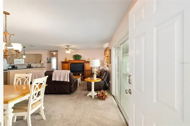 a bedroom with furniture and a view of living room