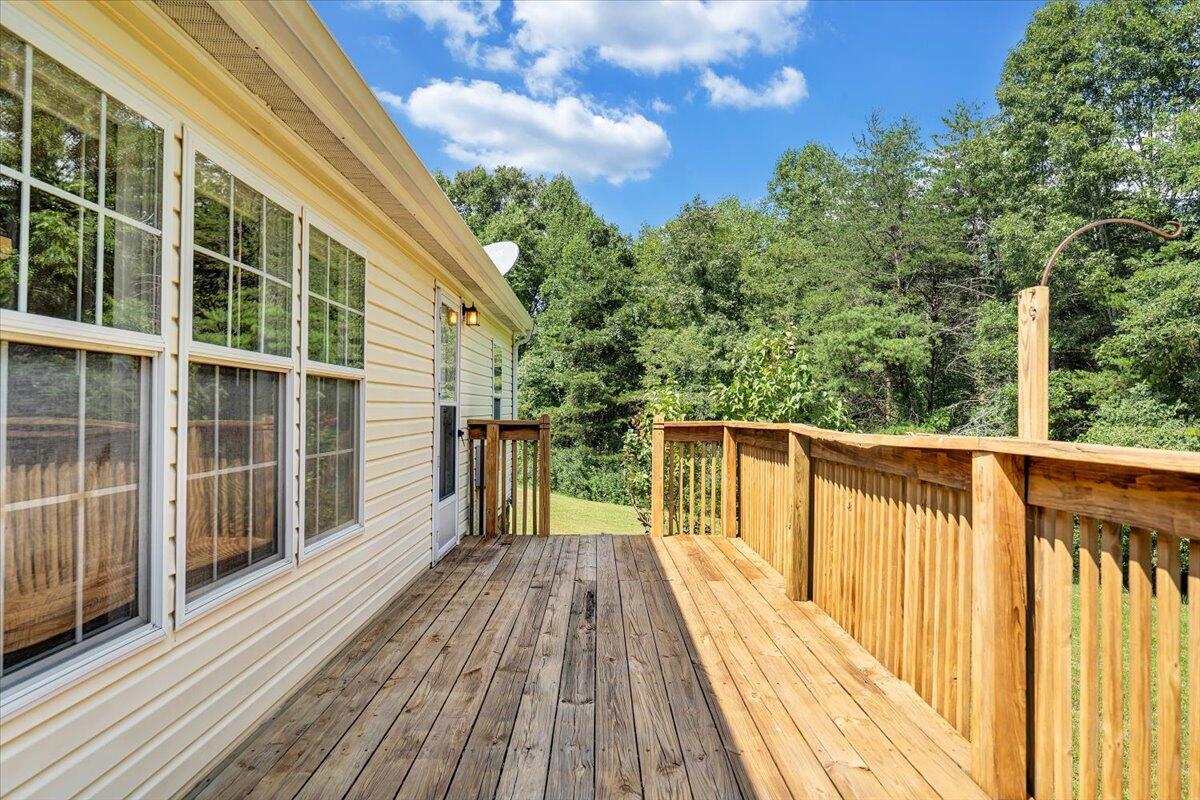 1102 Thomasson Mill Road Goodview, VA 24095 - Photo 29 of 45 a view of balcony with wooden floor and fence