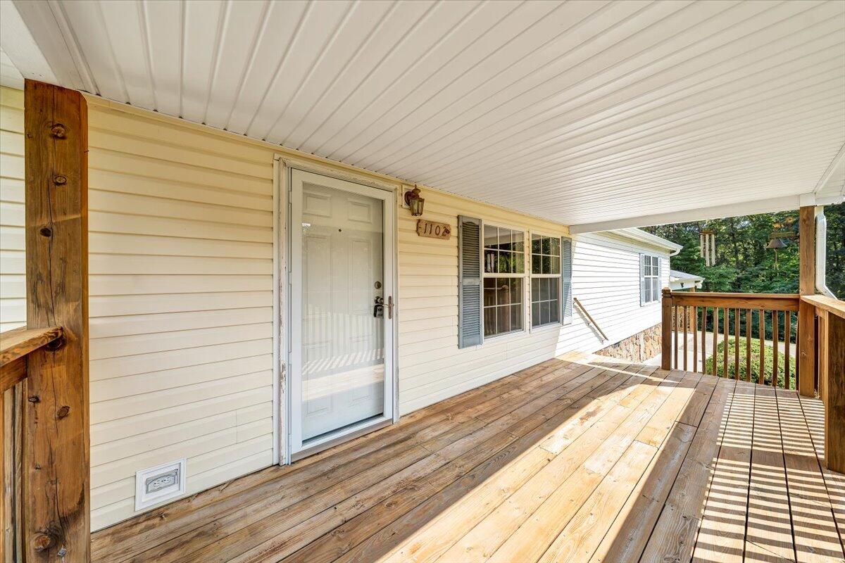 1102 Thomasson Mill Road Goodview, VA 24095 - Photo 41 of 45 a view of a balcony with wooden floor