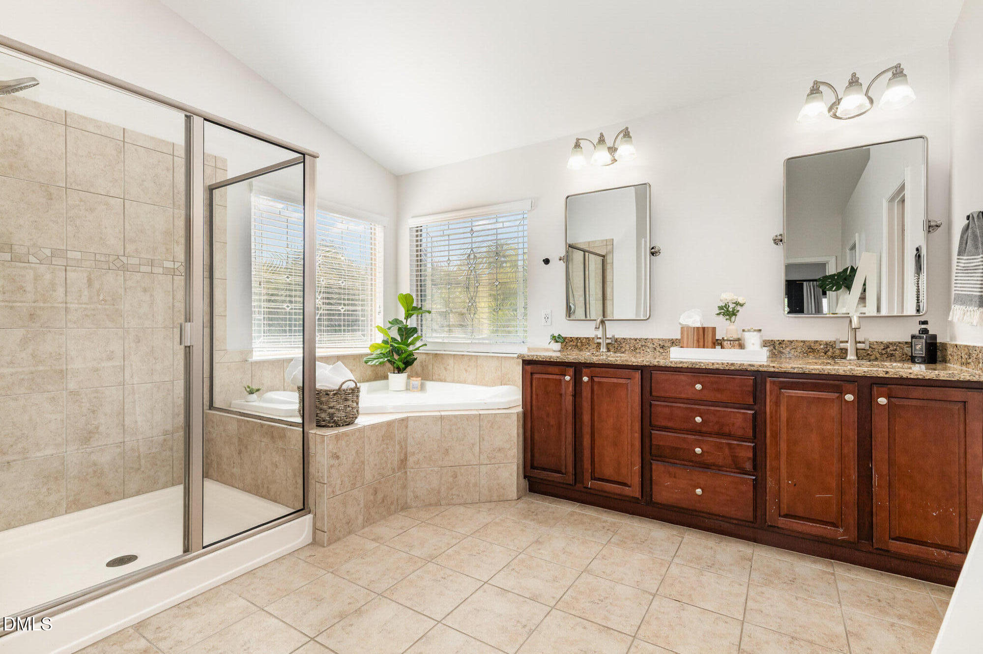 1956 Lazio Lane Apex, NC 27502 - Photo 26 of 47 a bathroom with a tub sink and mirror