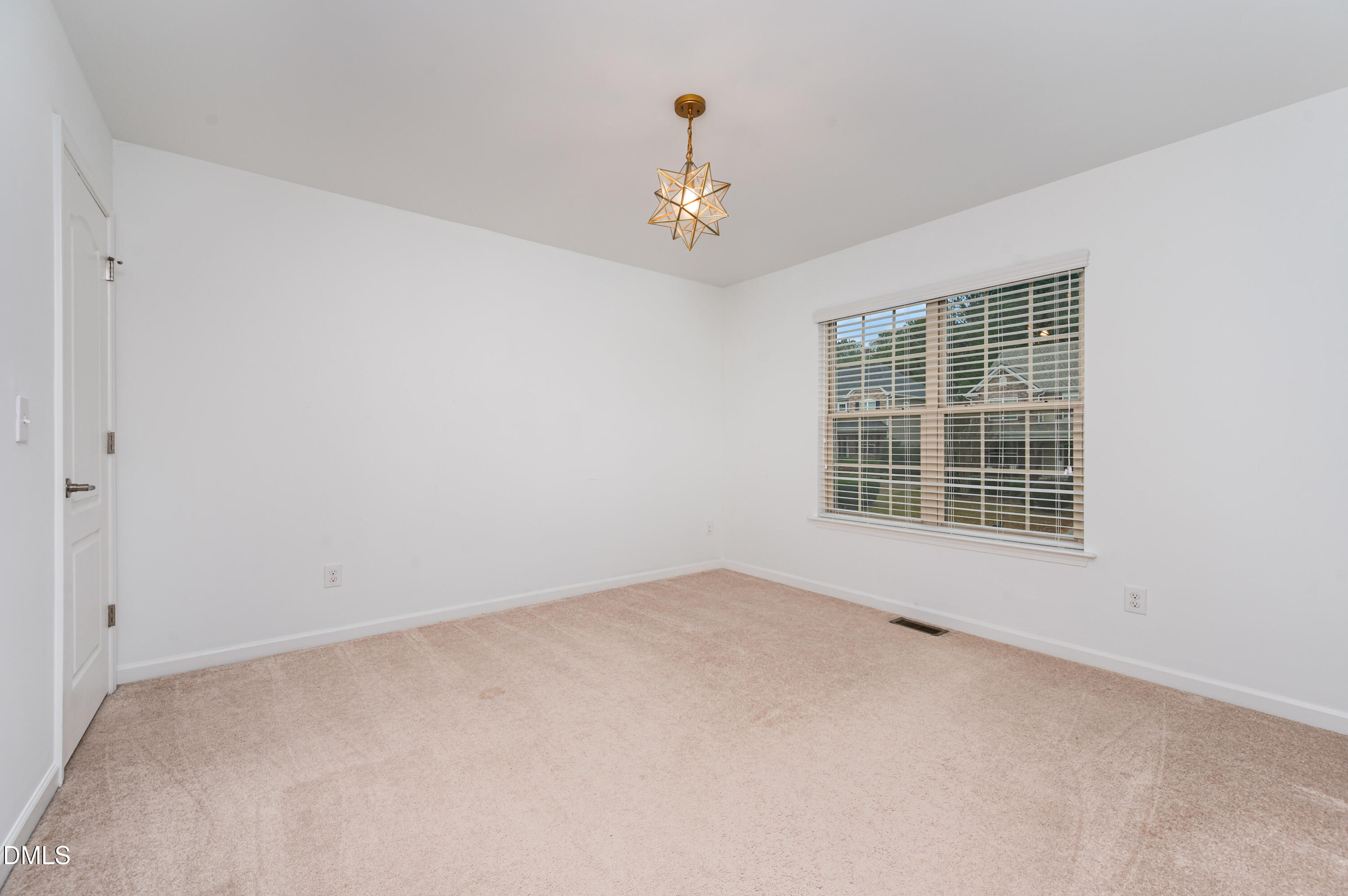 1956 Lazio Lane Apex, NC 27502 - Photo 31 of 47 an empty room with windows