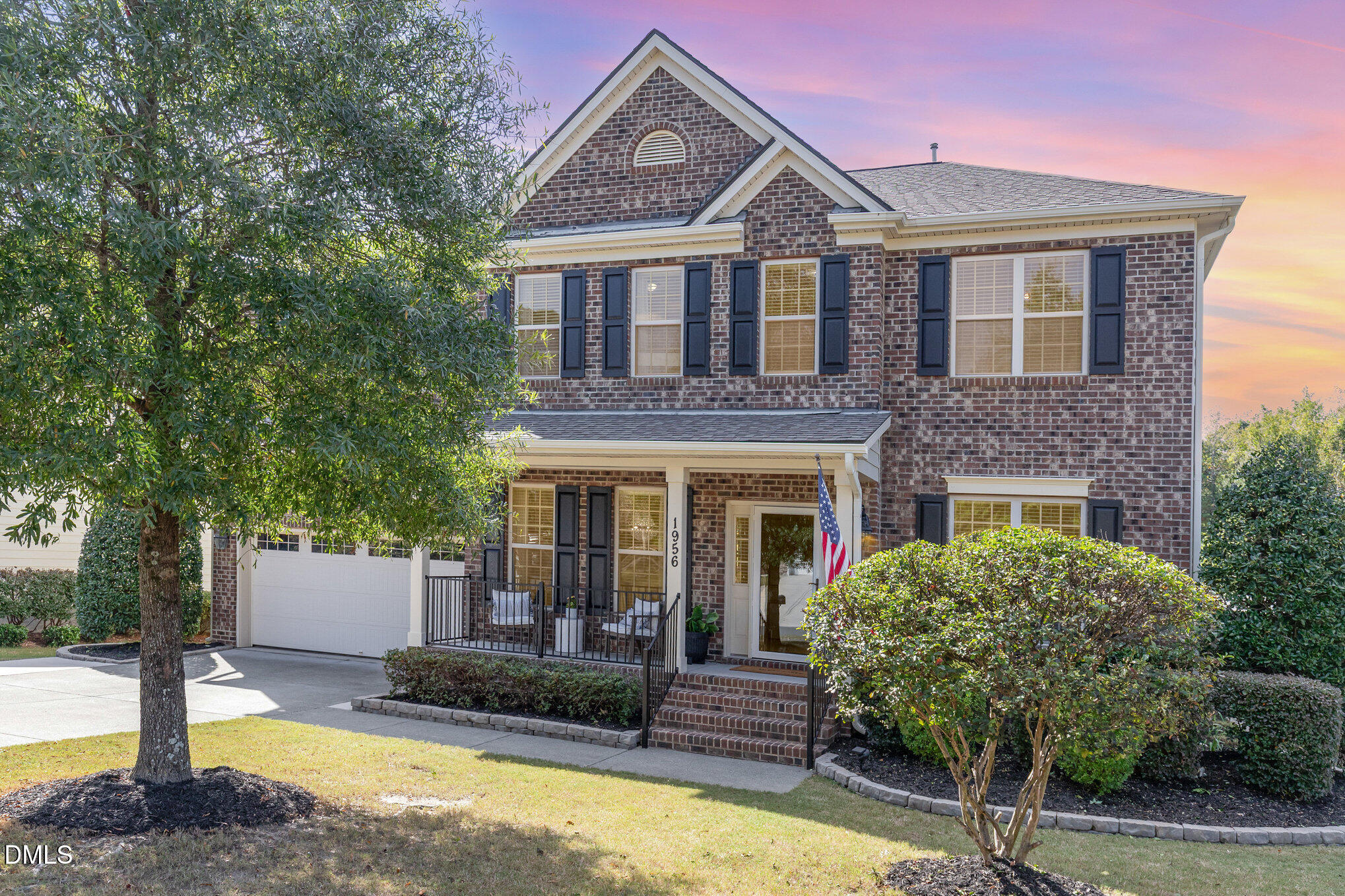 1956 Lazio Lane Apex, NC 27502 - Photo 47 of 47 a front view of a house with garden