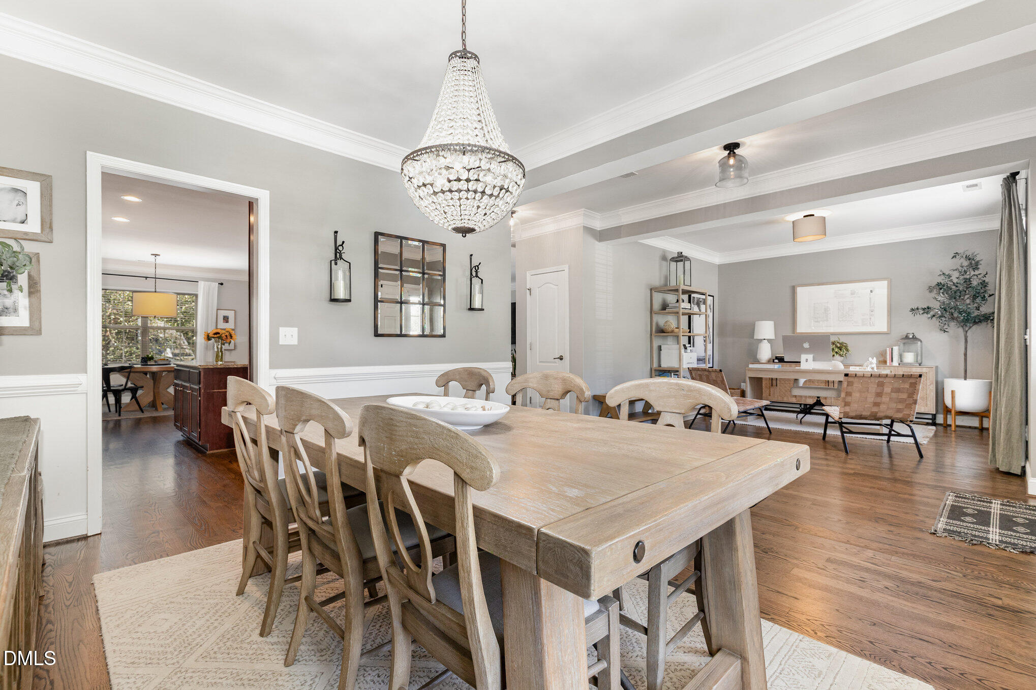 1956 Lazio Lane Apex, NC 27502 - Photo 5 of 47 a view of a dining room with furniture wooden floor and chandelier