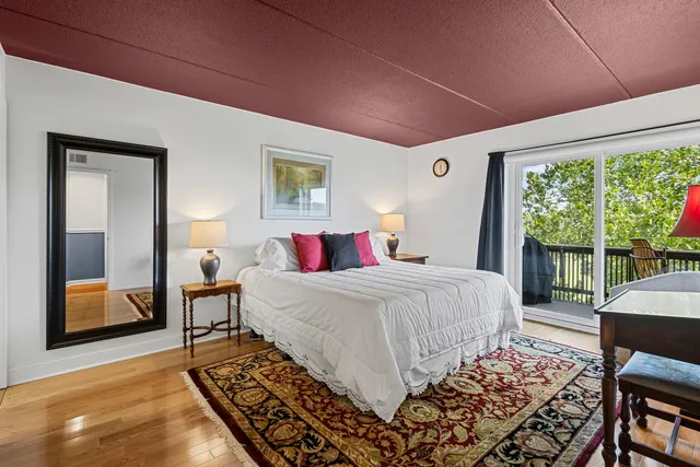 a bed room with a bed and a table