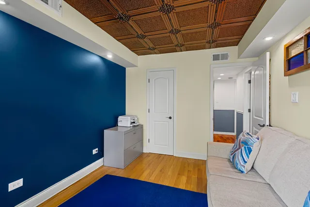 a bed room with a bed and a book shelf
